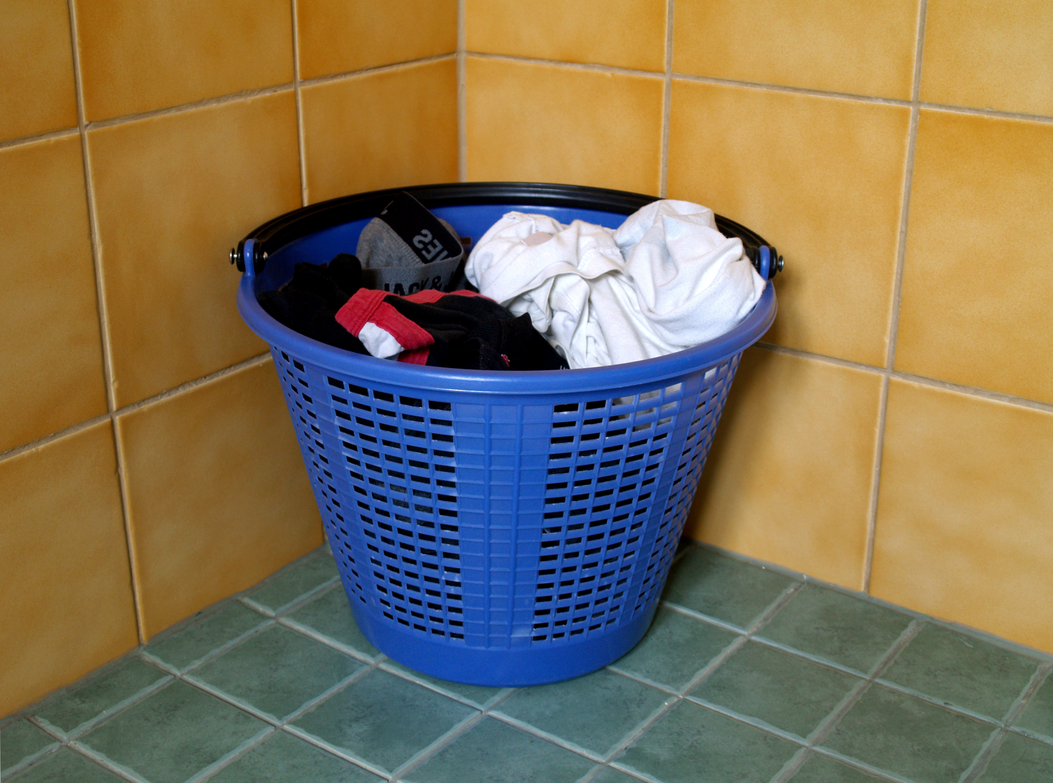 Neatly folded stacks of clean household laundry.